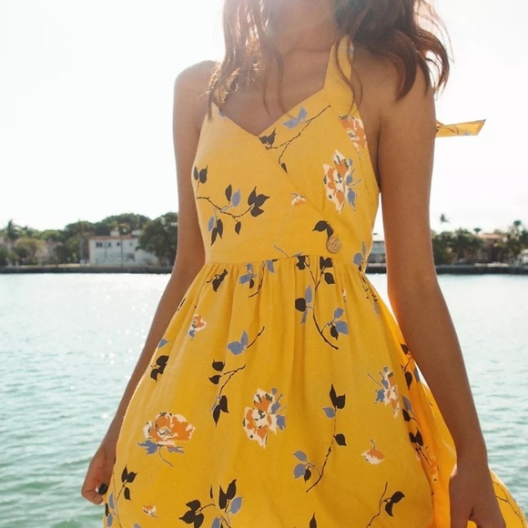 Urban Outfitters Dresses & Skirts - UO Pippa Halter Mini Dress women’s size small. Halter tie, yellow floral print.